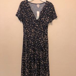 Navy blue dress with tan print. Size small.